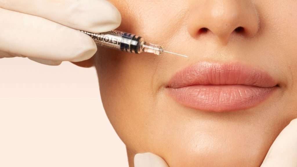 a person getting botox injection